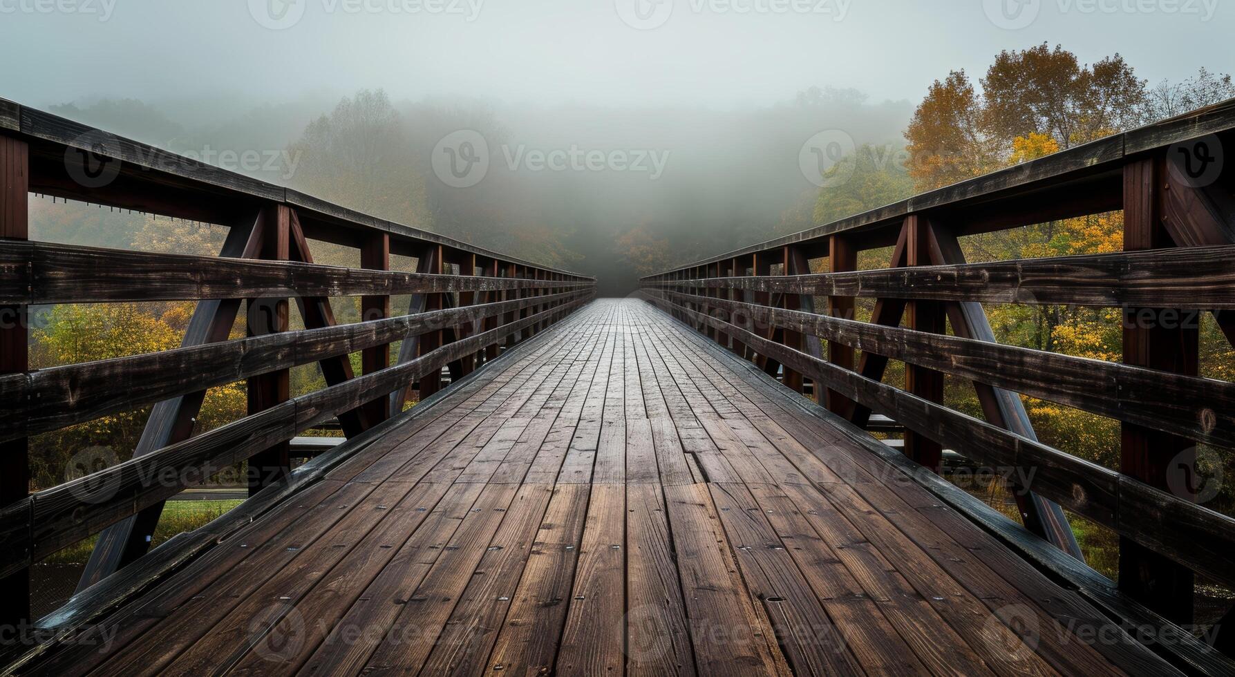 Misty Wooden Bridge Leading into Autumn Forest photo
