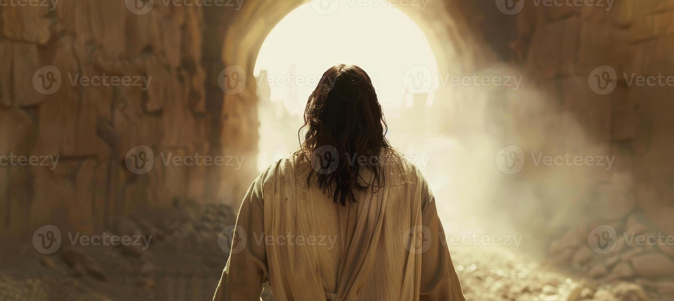 Mystical figure walking towards light at the end of a tunnel photo