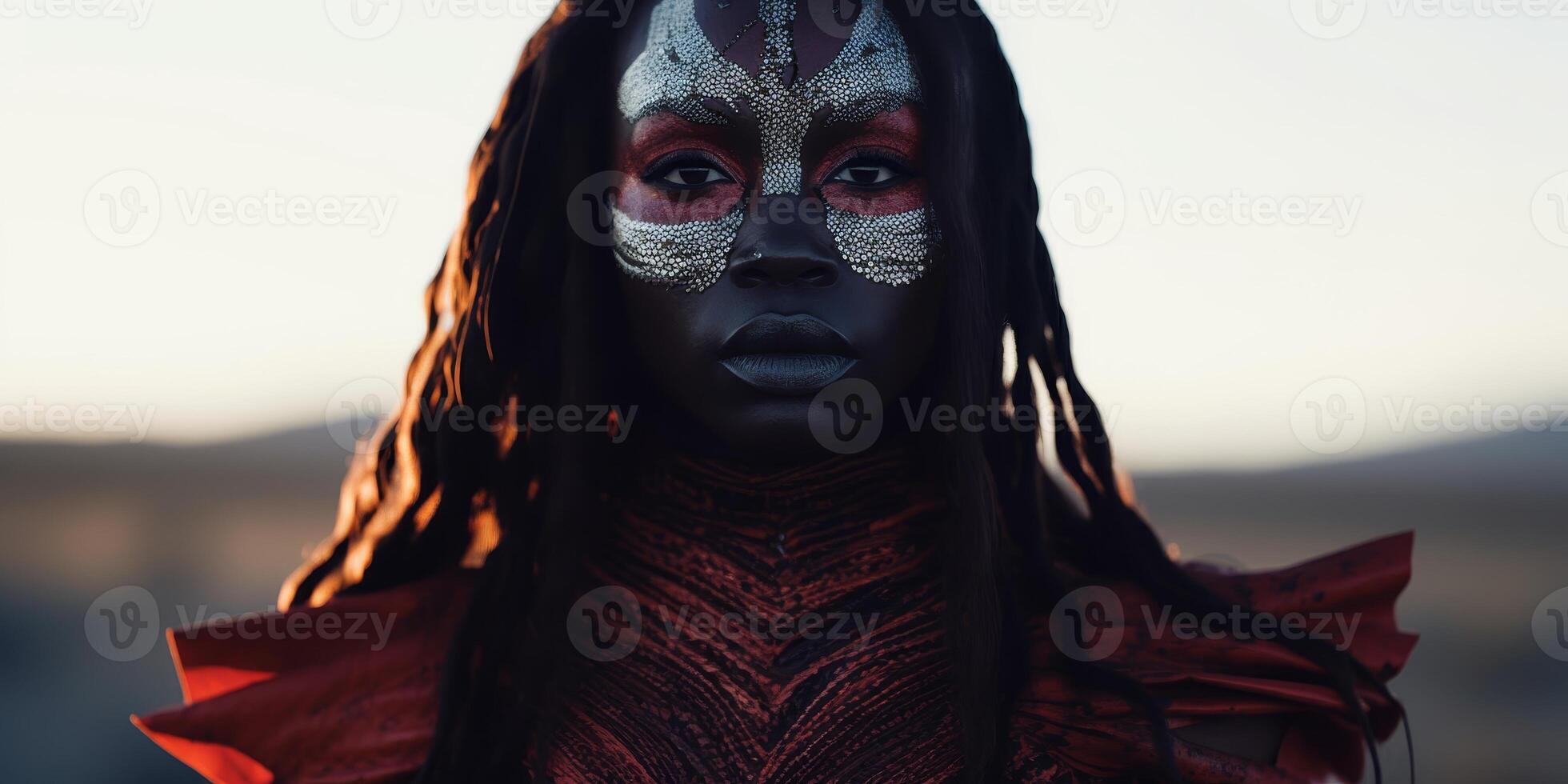 Portrait of a woman with artistic tribal makeup in a natural setting at dusk photo