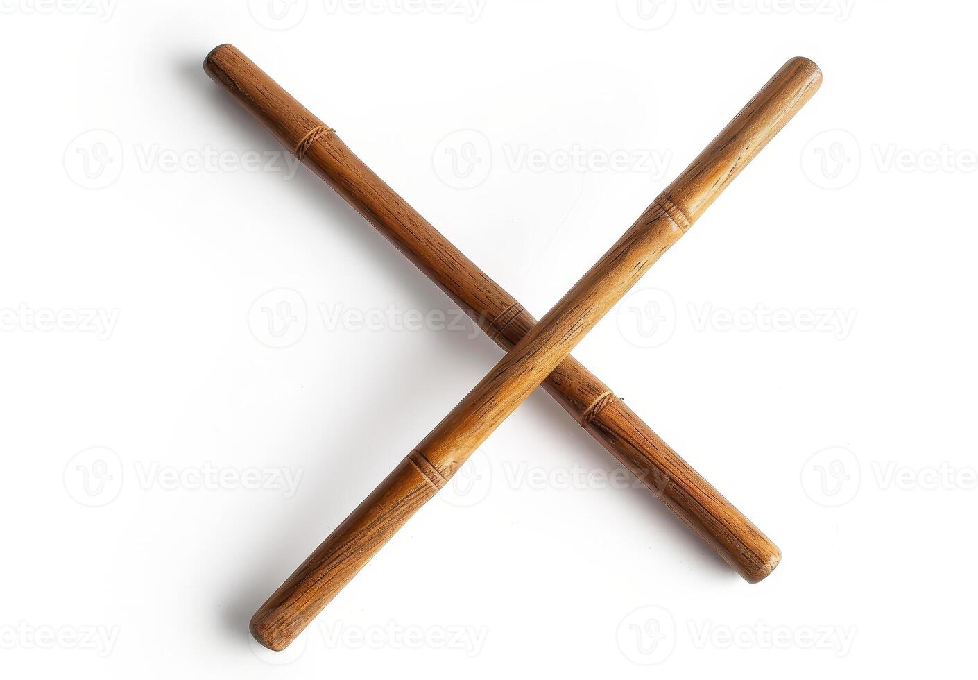 Two wooden batons crossed on a white background photo
