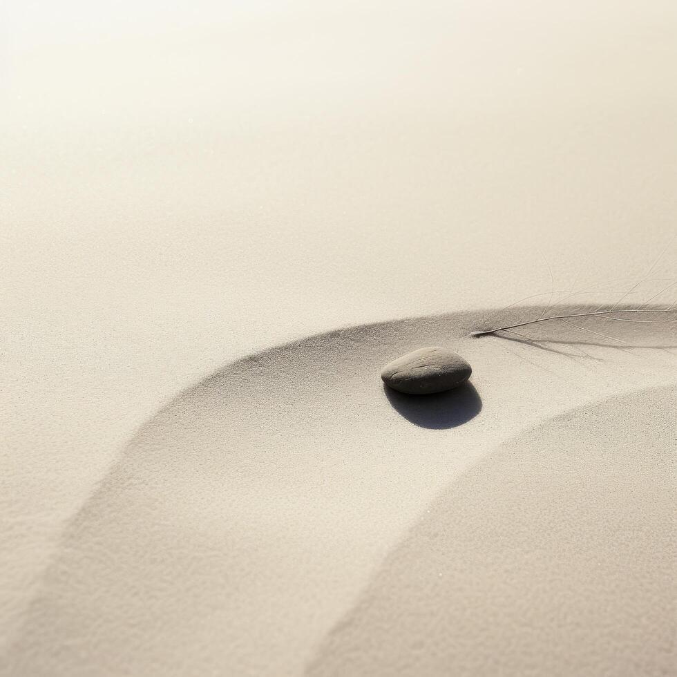 Zen stone on smooth sand with delicate shadow photo