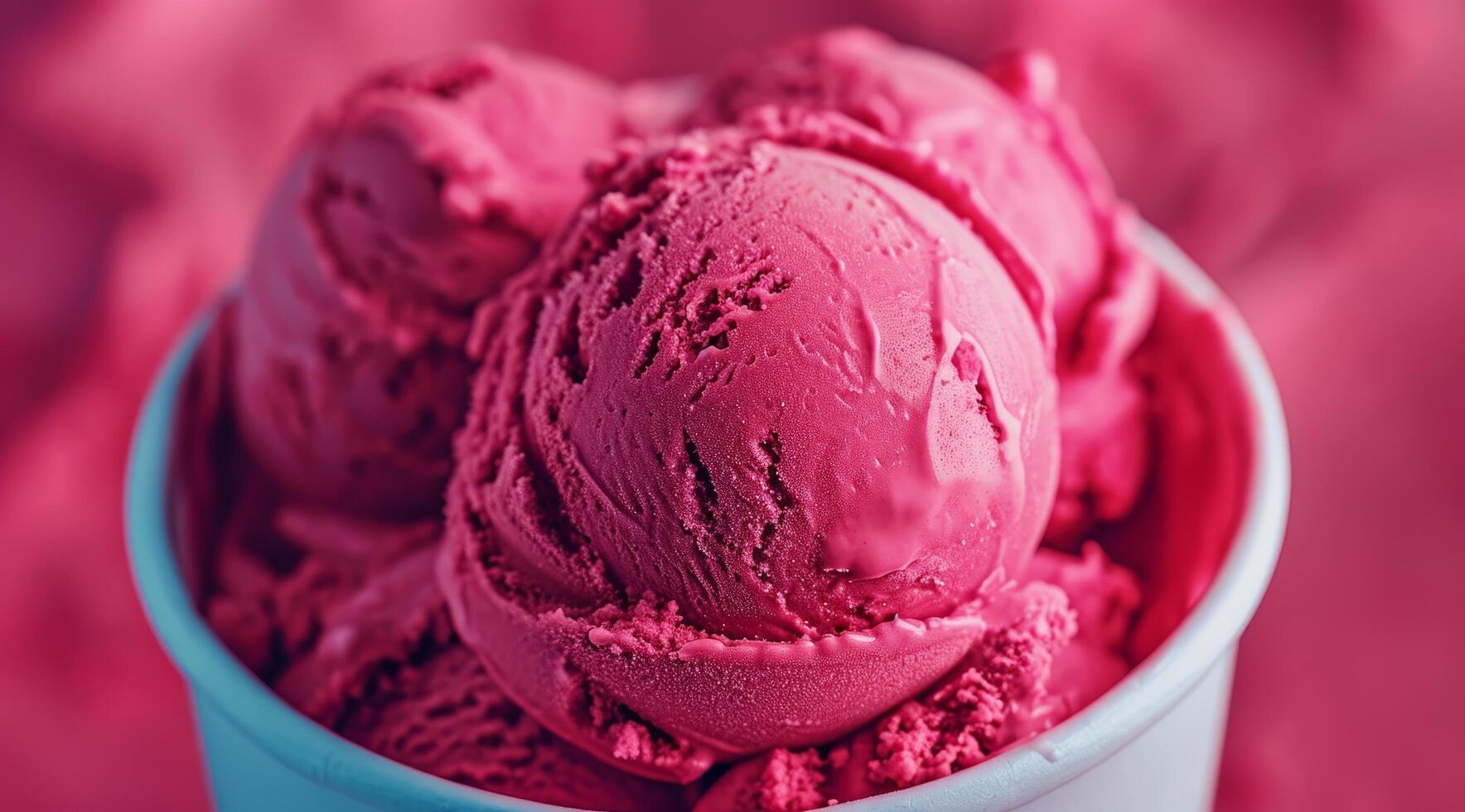 Close up of vibrant raspberry ice cream in a bowl photo
