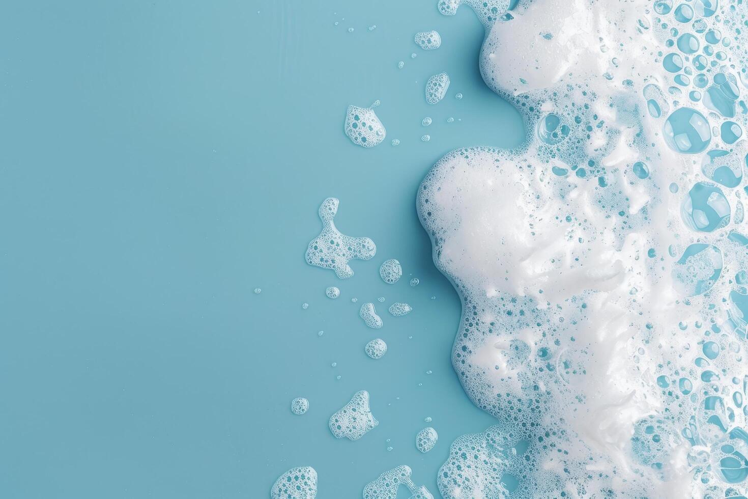 Soft white foam bubbles on a clean blue surface photo
