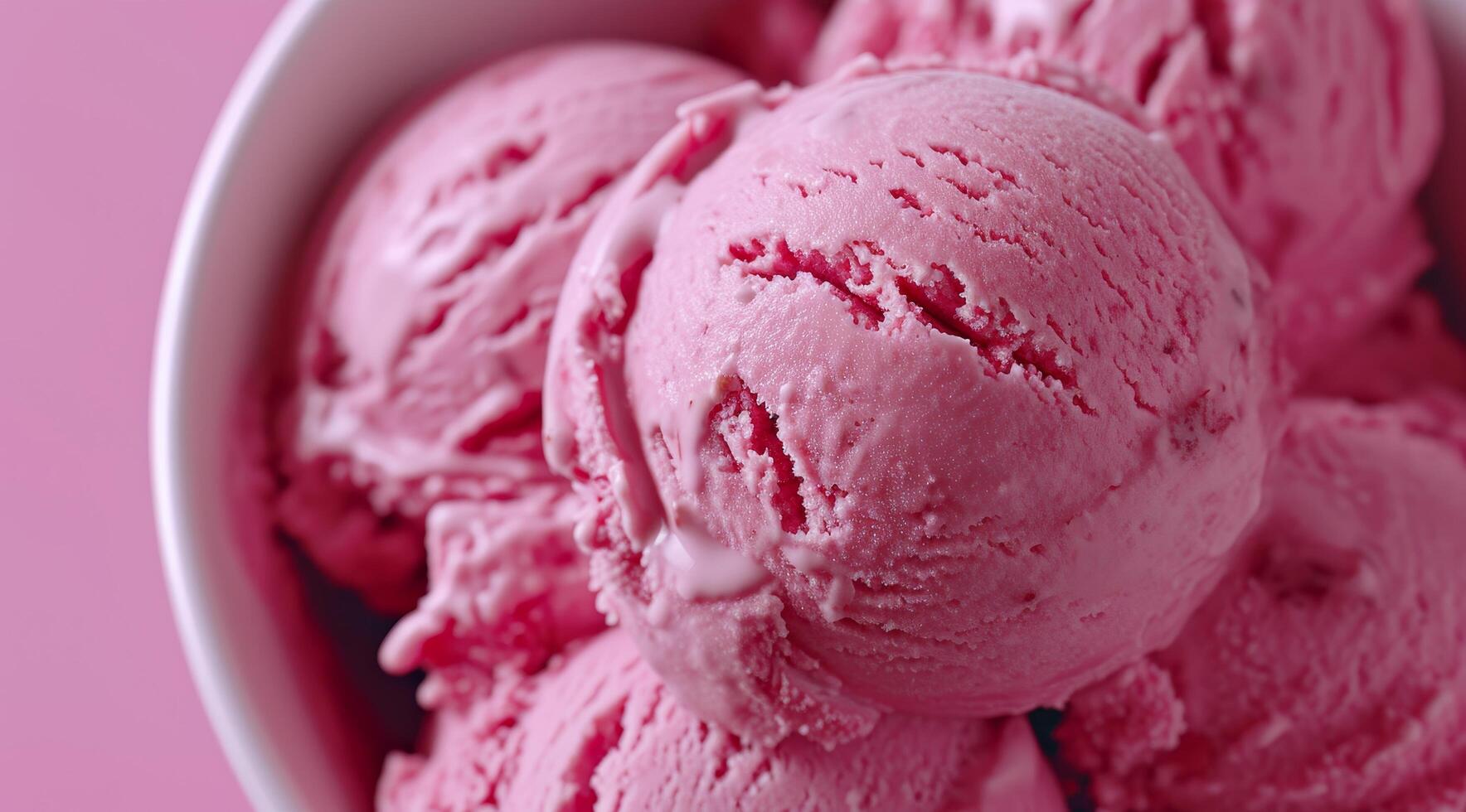 Close up of Scoops of Strawberry Ice Cream in a Bowl photo