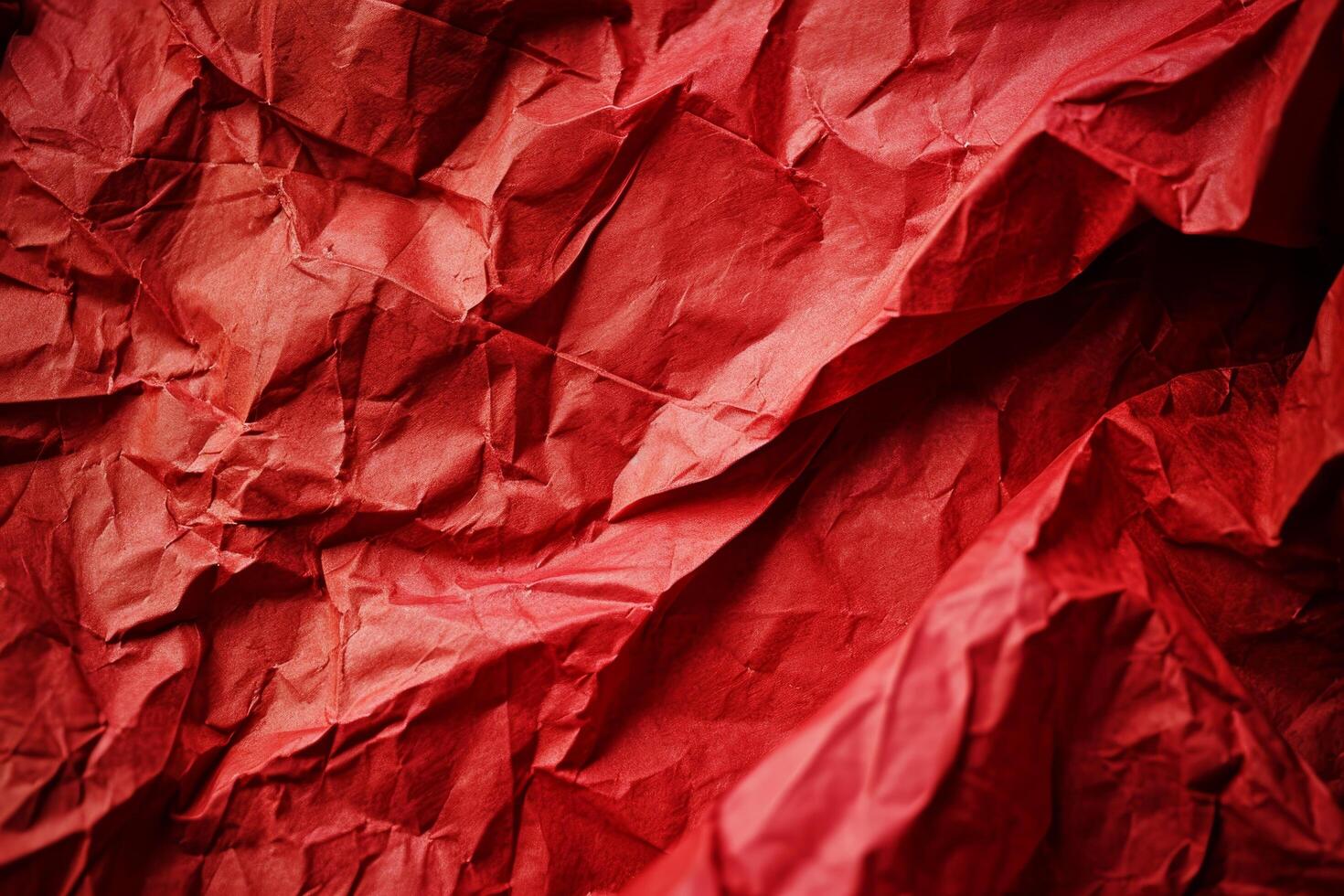Close up of crumpled red paper texture photo