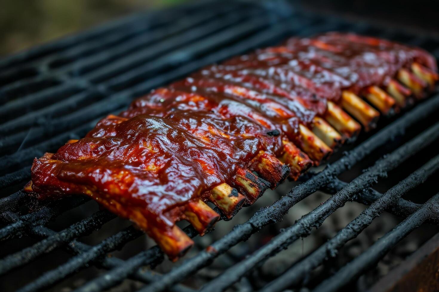 Juicy barbecued ribs on a grill photo