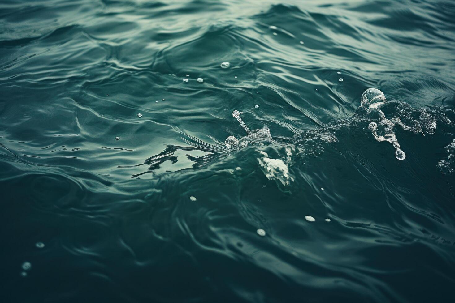Serene Water Surface with Gentle Waves and Bubbles photo