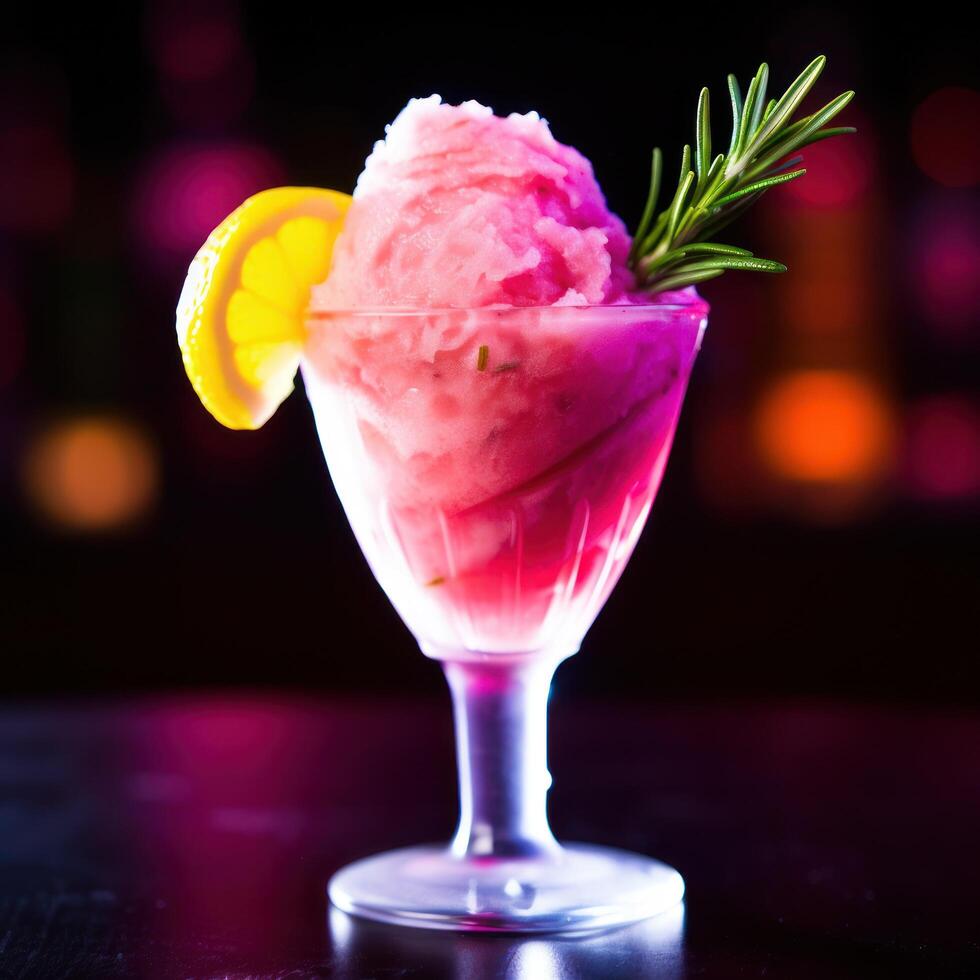 Colorful Sorbet in a Glass with a Lemon Slice and Rosemary Garnish photo