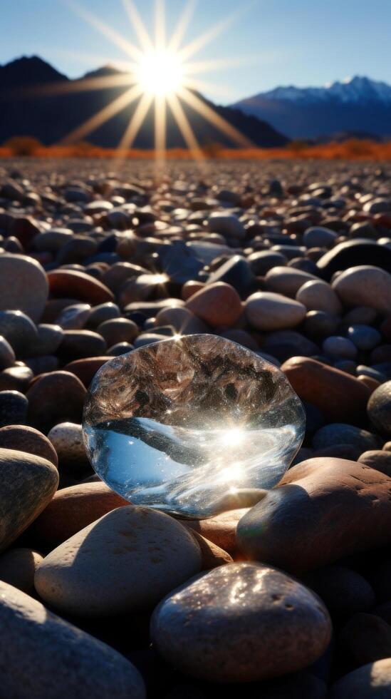 a close up of a glass object on a rocky beach photo