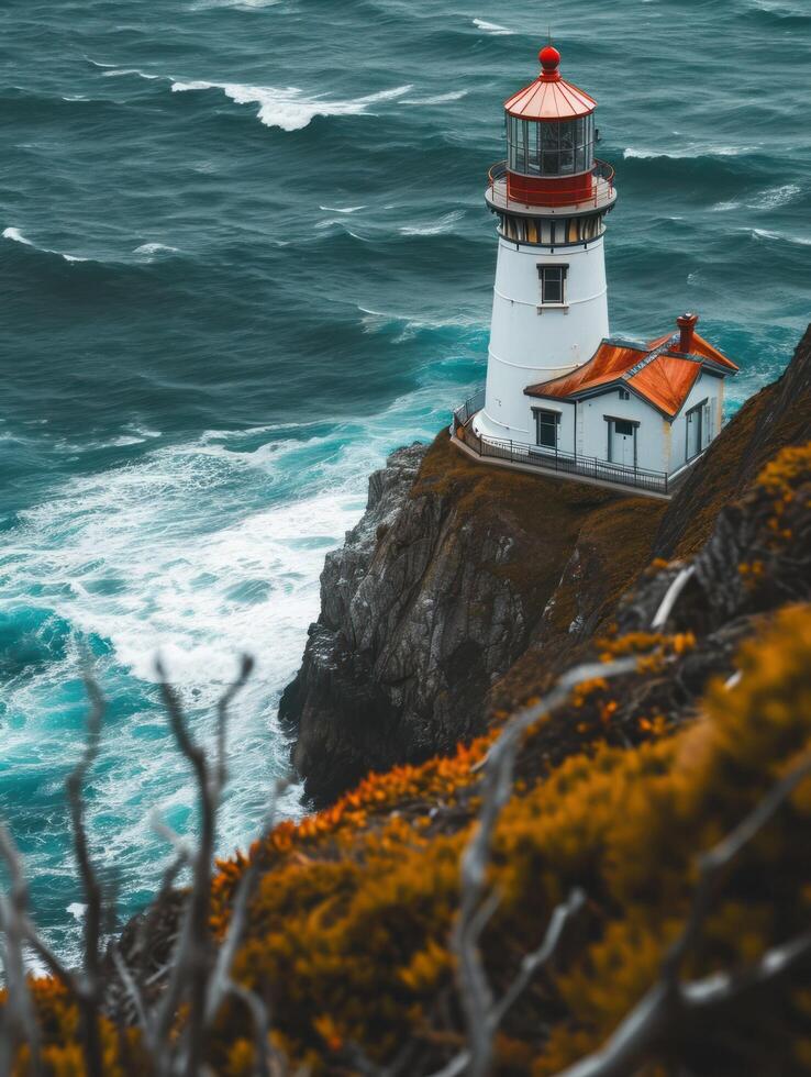 a lighthouse on a cliff above the ocean photo