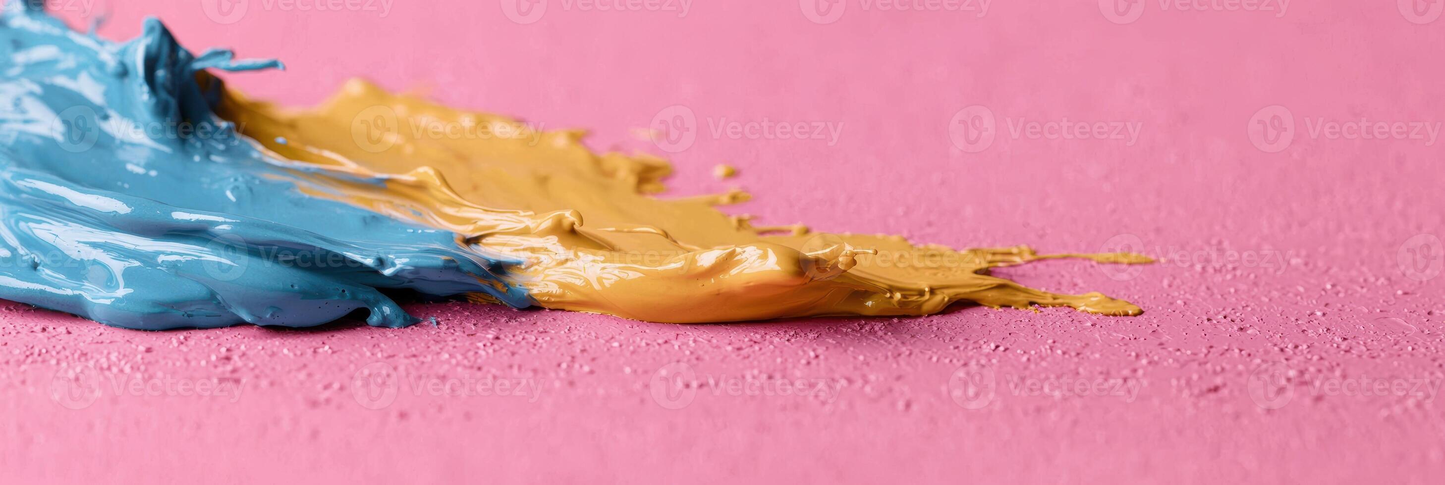 abstract colorful paint splash on pink background photo