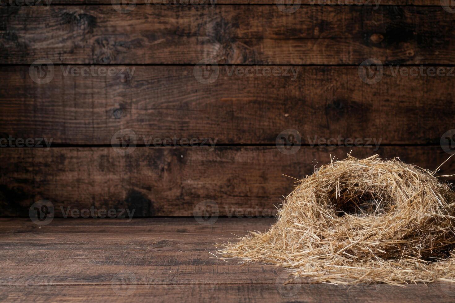 Rustic wooden background with straw pile photo
