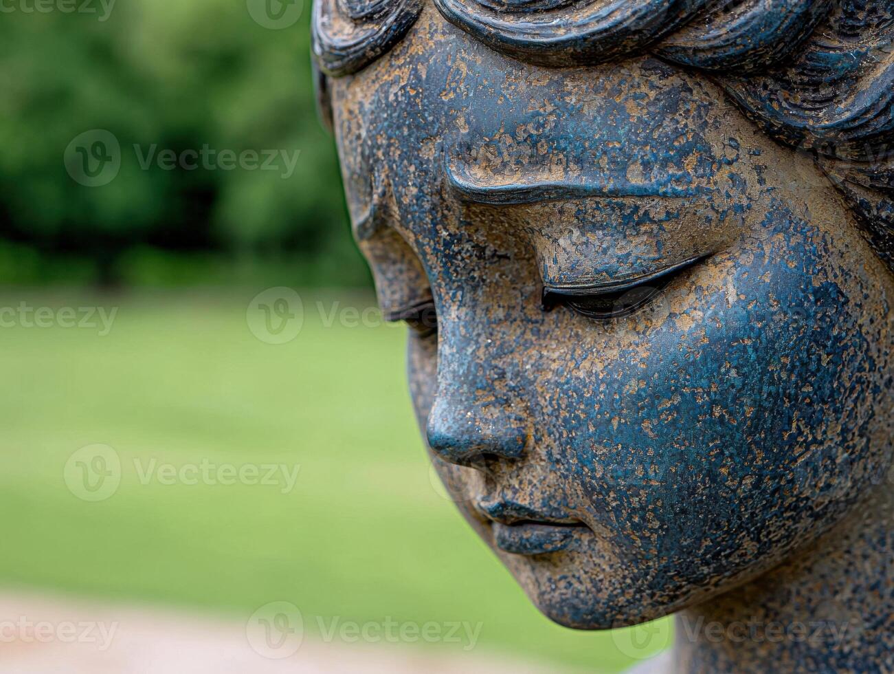 close up of a weathered bronze buddha statue photo