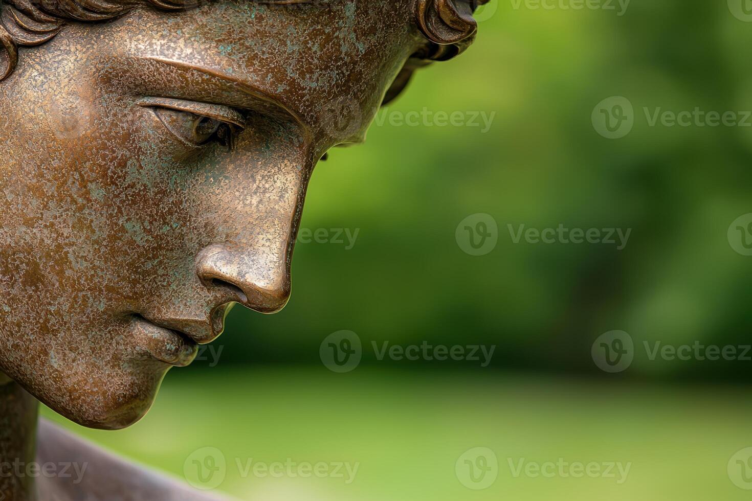 Closeup of weathered bronze buddha statue photo