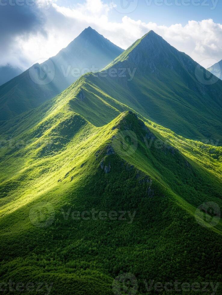 Majestic green mountain peaks under cloudy sky photo