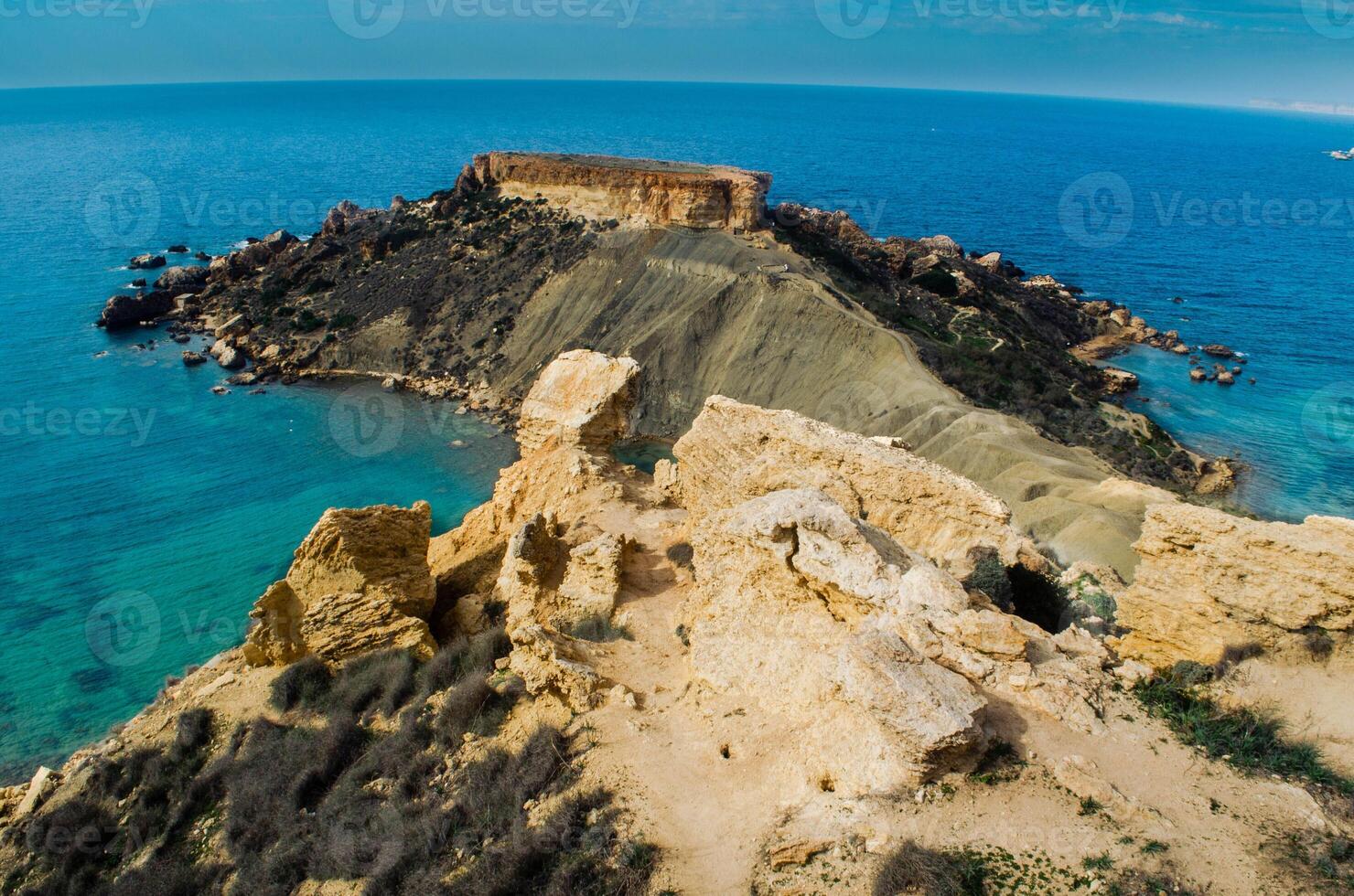 Majestic Cliff Overlooking Crystal Clear Waters photo