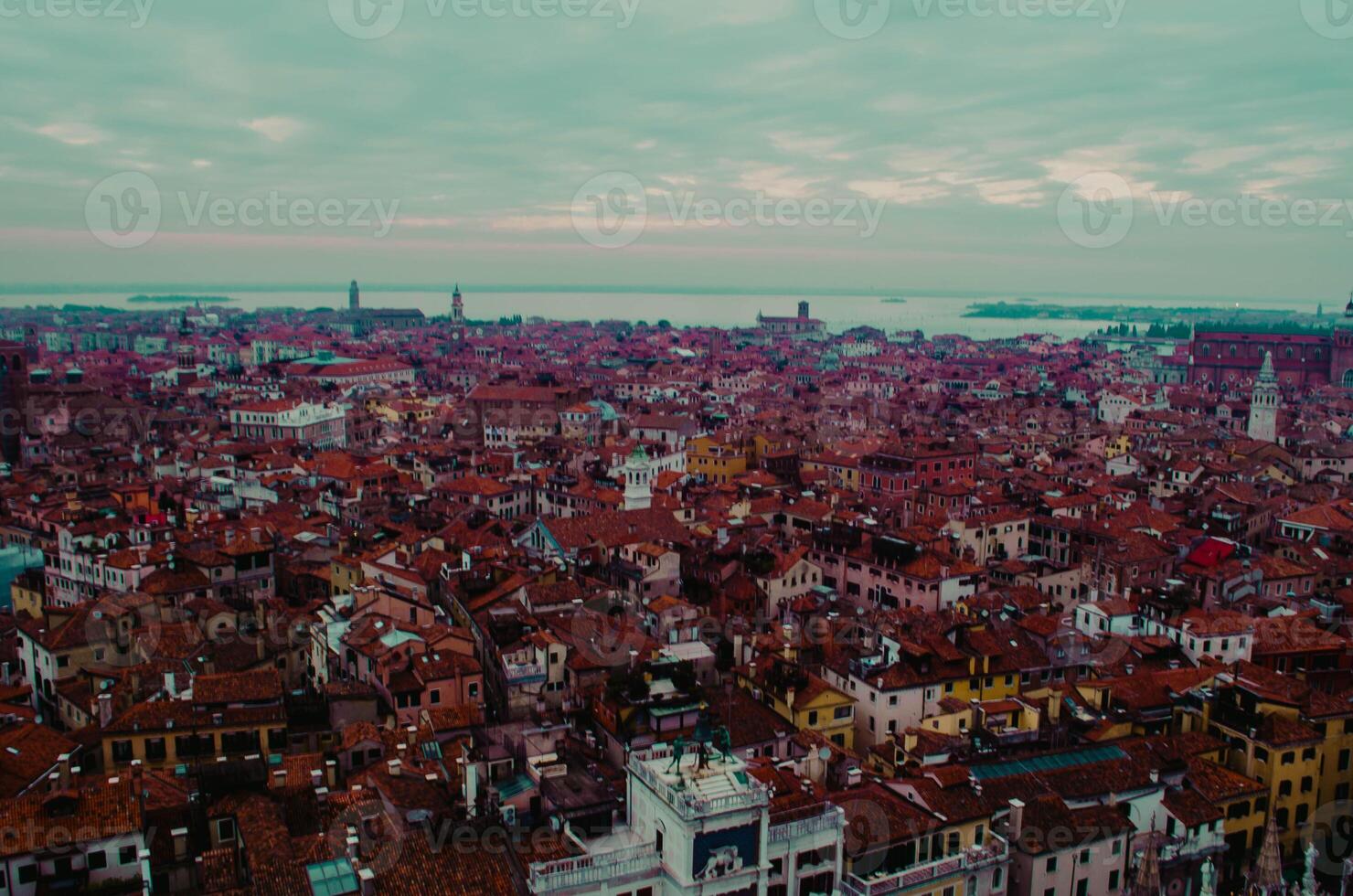 Panoramic View Red Rooftops and Historic Features in Venice photo