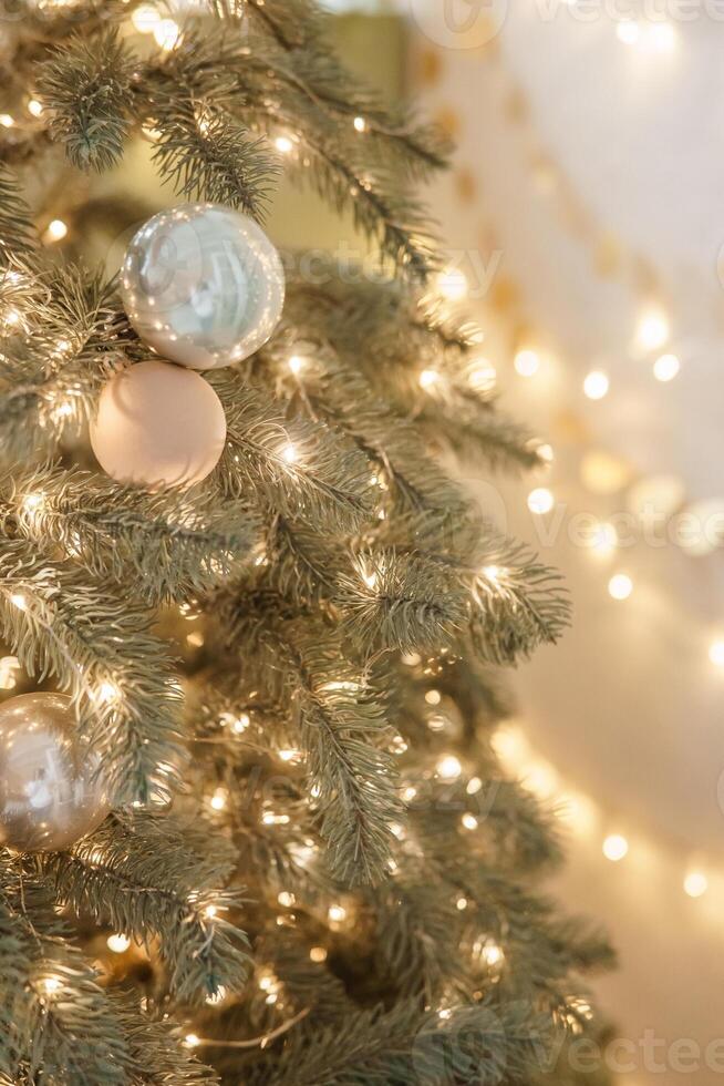Christmas balls in close-up on the Christmas tree. Decorations for Christmas trees. The concept of celebrating New Year and Christmas photo