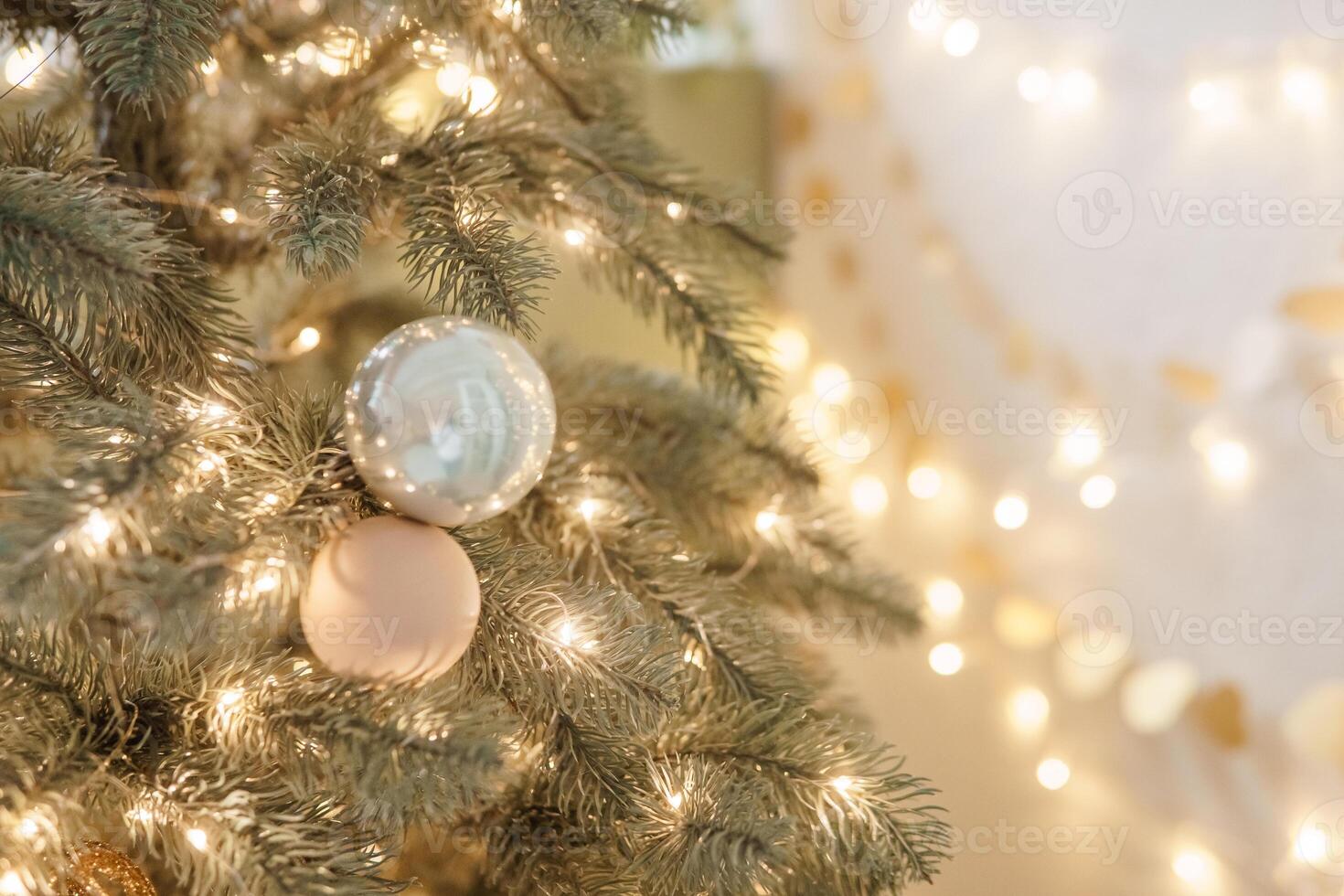 Christmas balls in close-up on the Christmas tree. Decorations for Christmas trees. The concept of celebrating New Year and Christmas photo