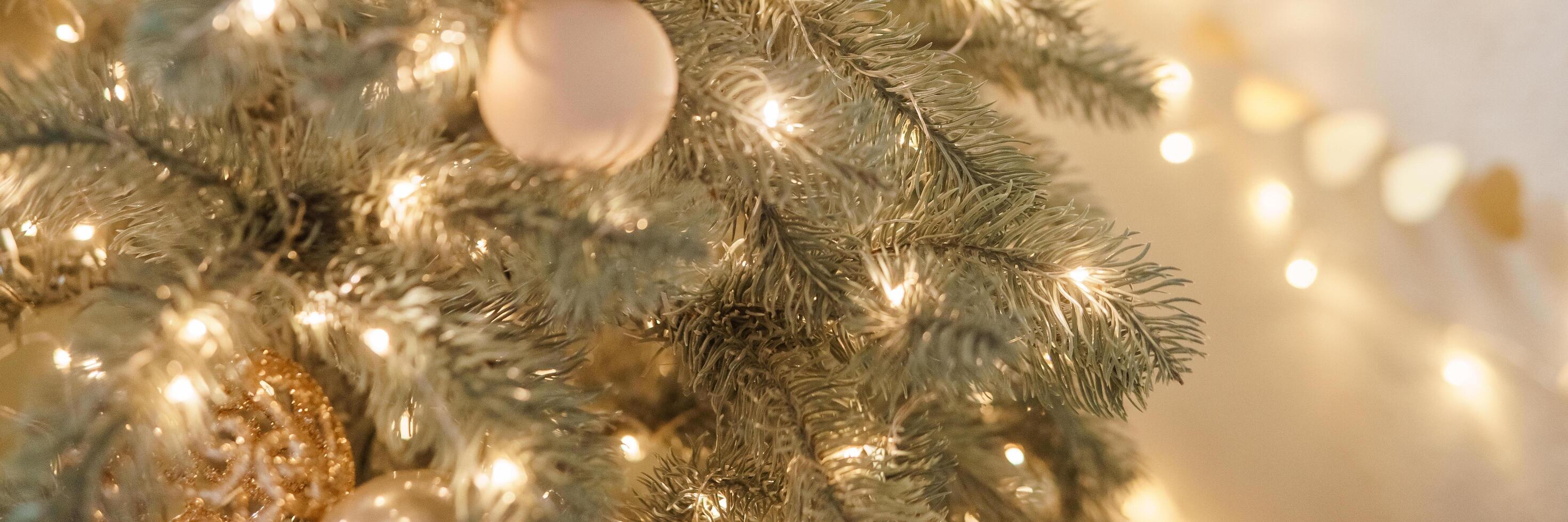 Christmas balls in close-up on the Christmas tree. Decorations for Christmas trees. The concept of celebrating New Year and Christmas photo