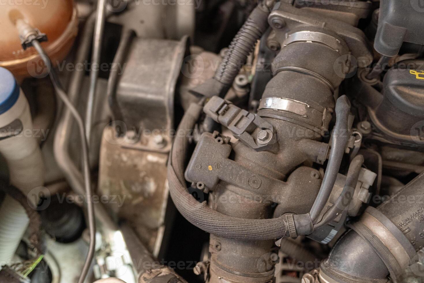 detail of the engine of a diesel car in a garage for inspection photo
