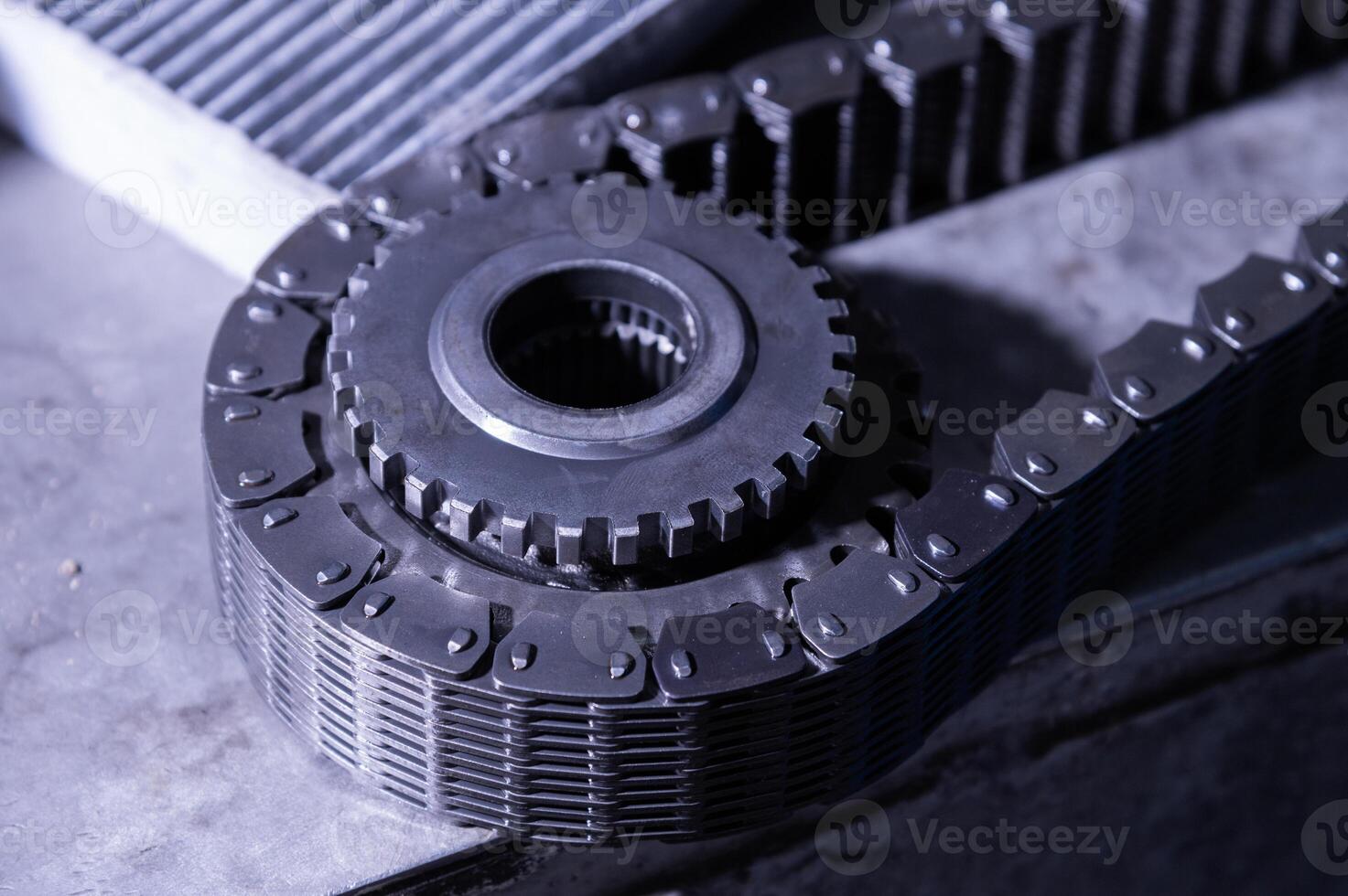 Uninstalled transfer case gear with wide torque chain. Tinted repair image photo
