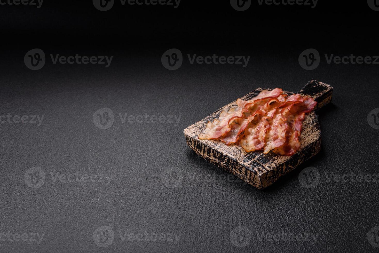 Bacon sliced, grilled with salt and spices photo