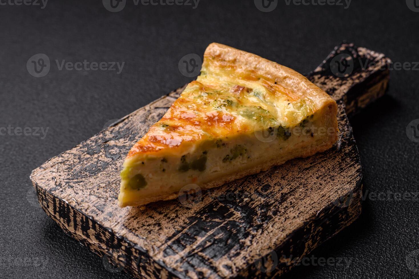 Delicious quiche with broccoli, cheese, chicken, spices and herbs photo