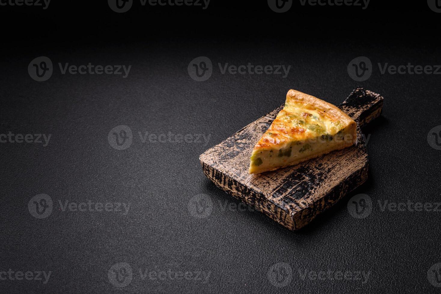 Delicious quiche with broccoli, cheese, chicken, spices and herbs photo