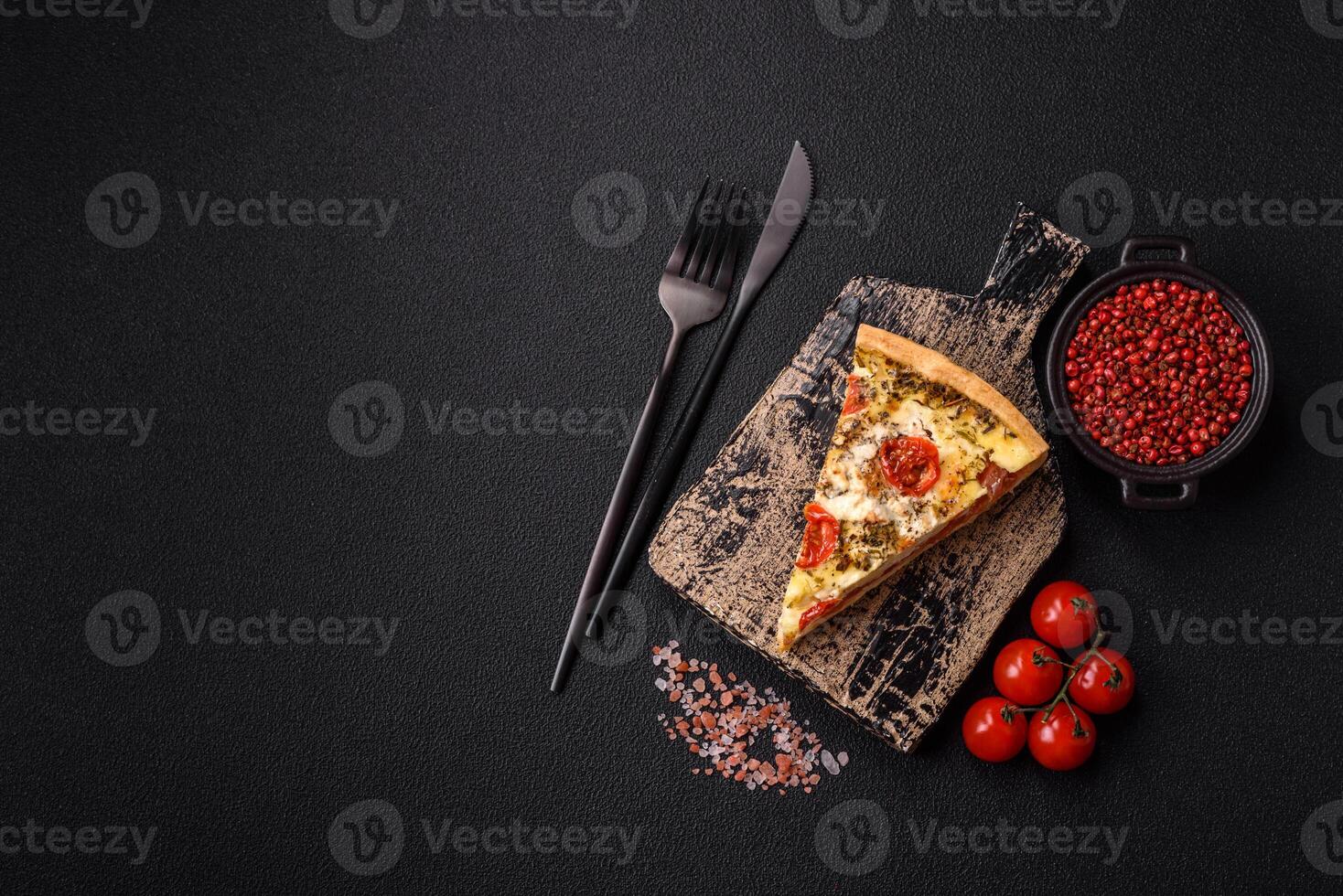 Delicious crispy quiche cut into slices with cheese, broccoli, tomatoes photo