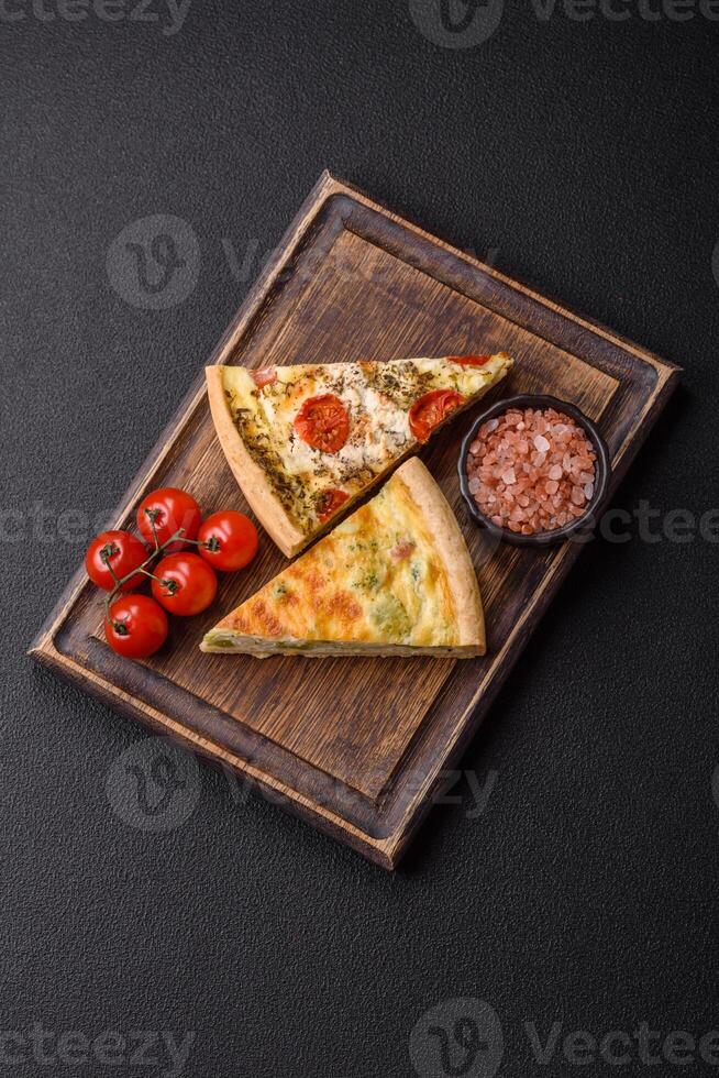 Delicious quiche with broccoli, cheese, chicken, spices and herbs photo