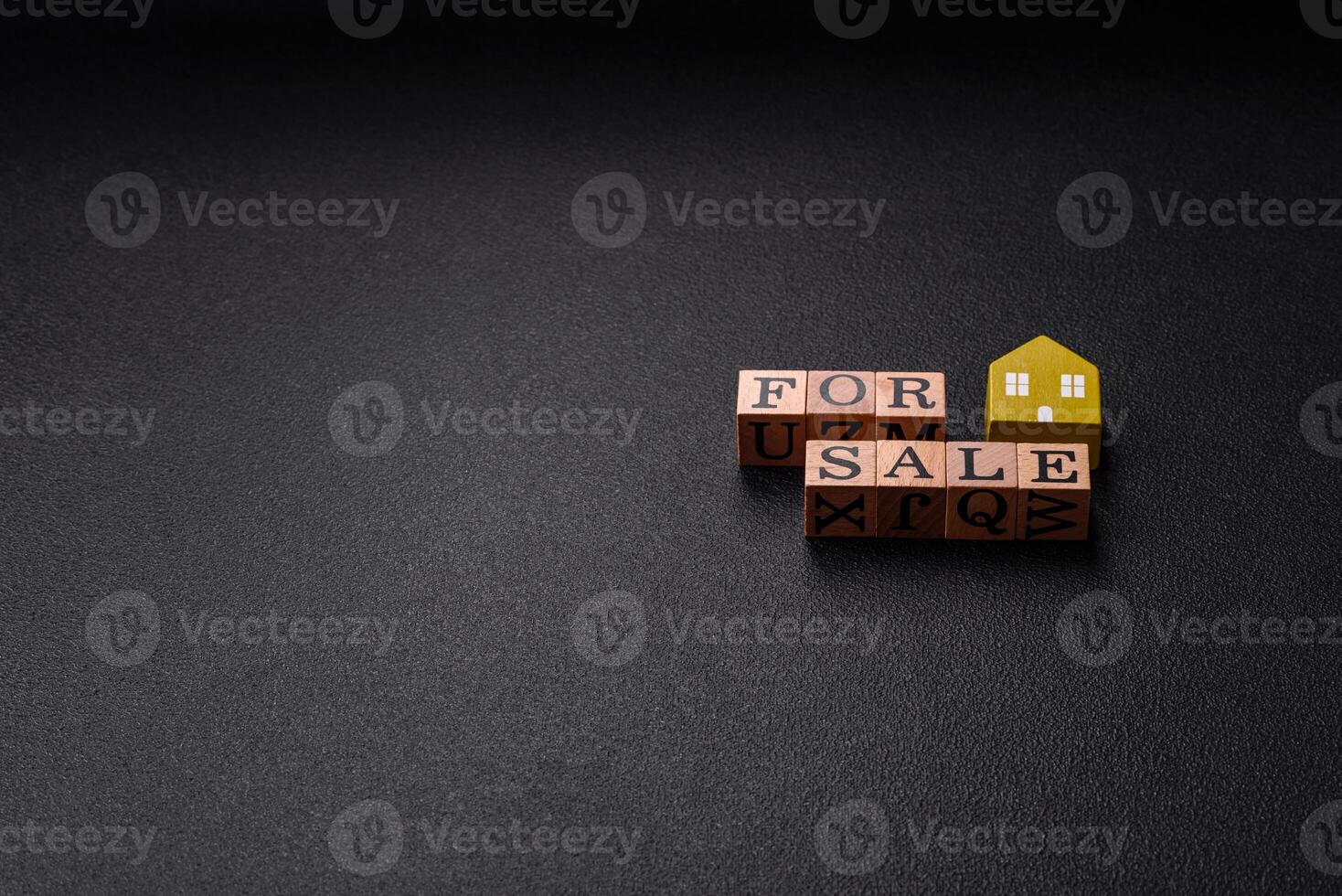 The inscription for sale laid out with wooden cubes photo