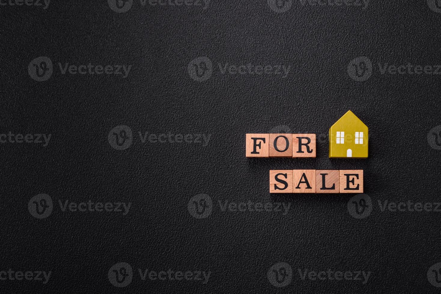 The inscription for sale laid out with wooden cubes photo