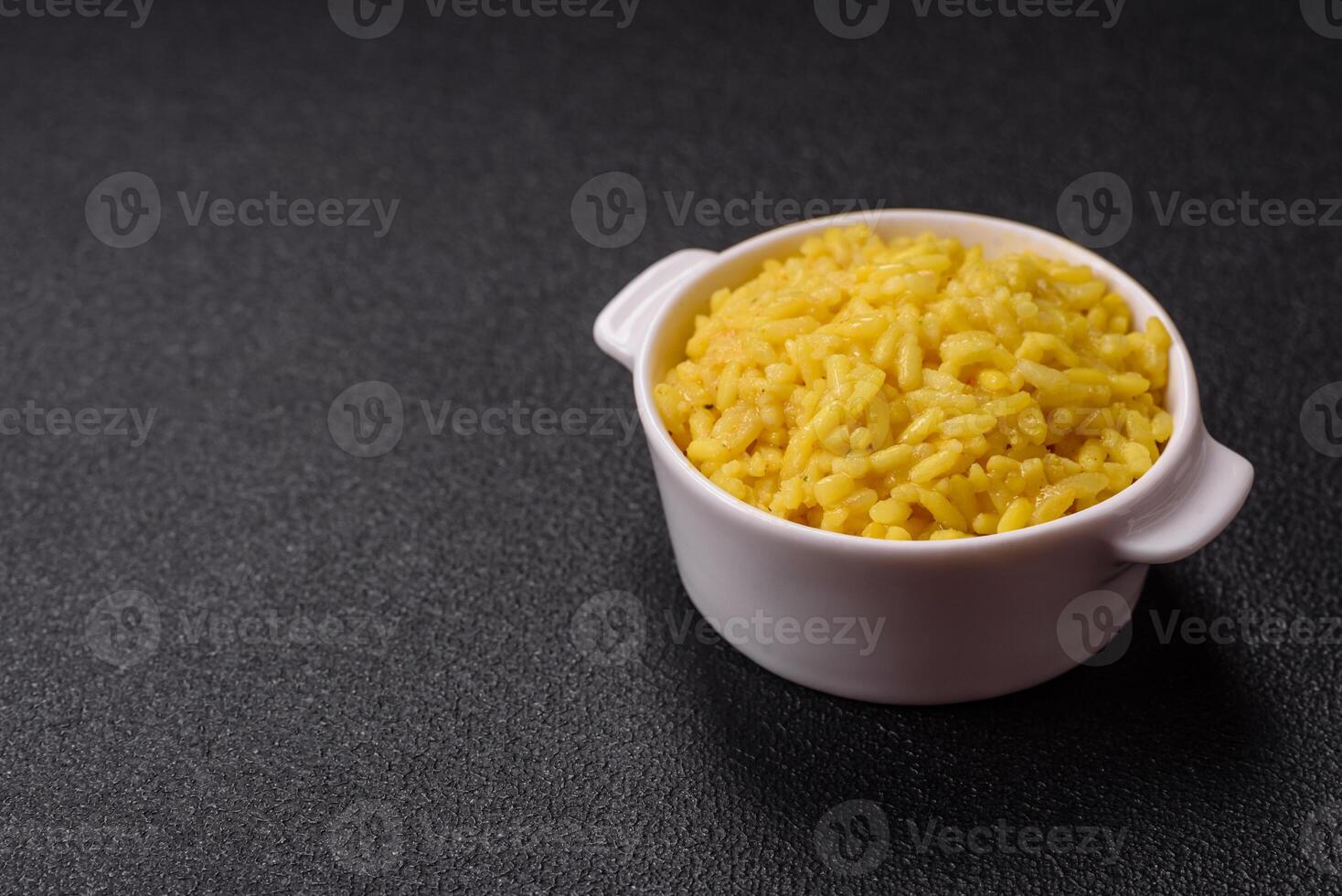 Italian arborio risotto rice with salt, spices and herbs photo
