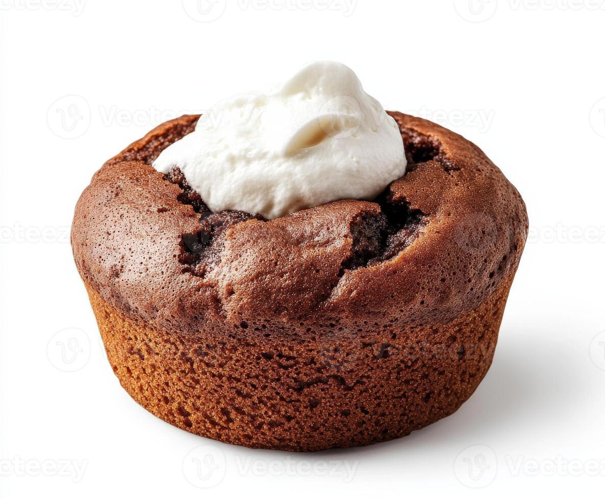 Chocolate muffin topped with whipped cream in a bright setting photo