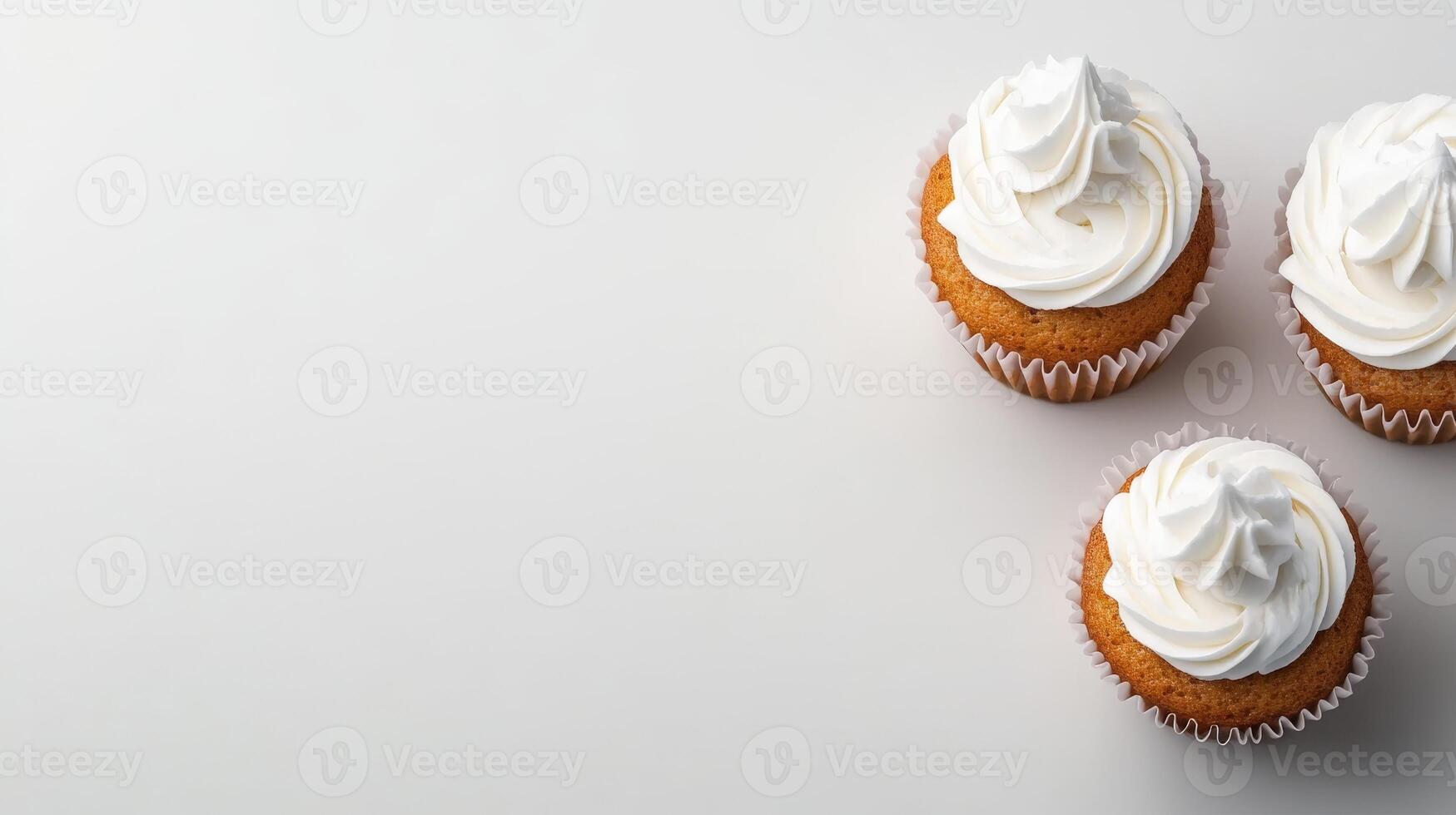 Delicious cupcakes with creamy frosting on a light background photo
