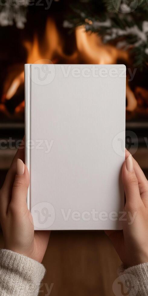 Cozy evening by the fireplace with a blank notebook photo