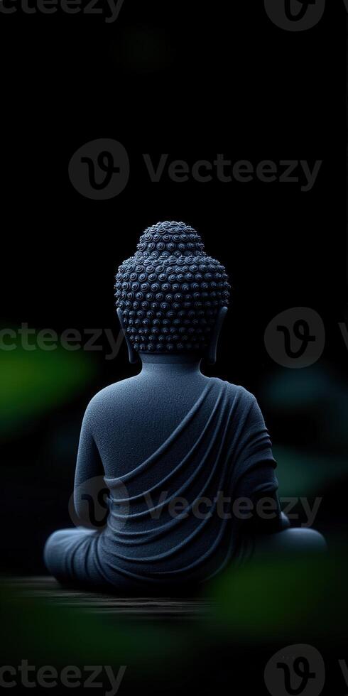 Peaceful Buddha statue in serene setting with dark backdrop photo