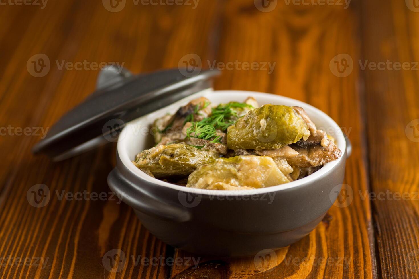 Brussel sprouts stewed in sour cream sauce with mushrooms and spices photo
