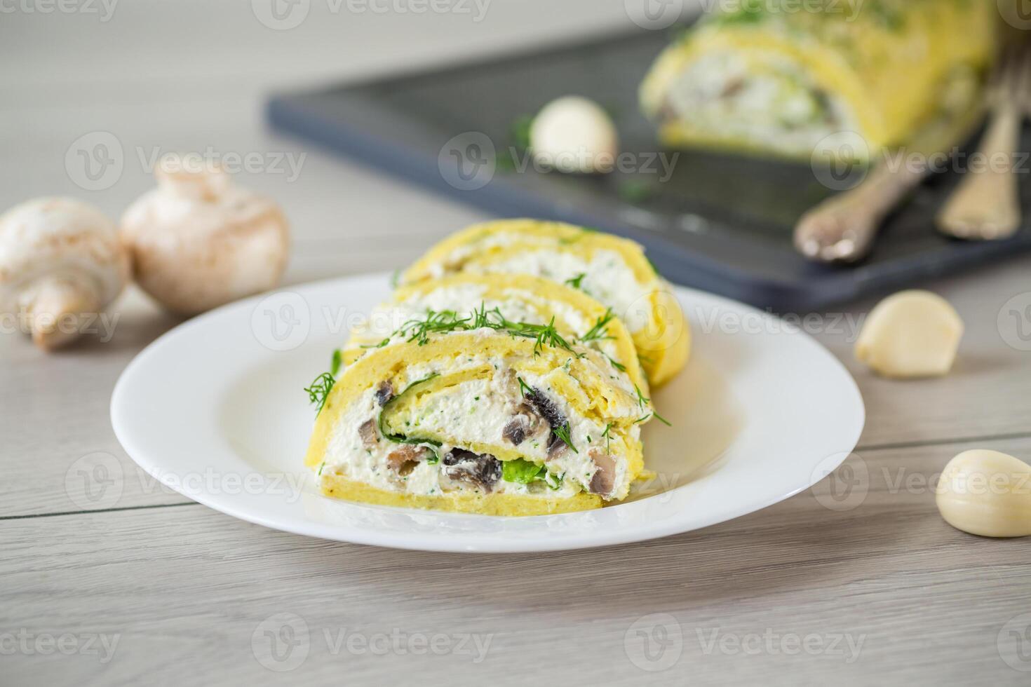 baked potato roll with cottage cheese filling with garlic and mushrooms, on a light wooden table photo