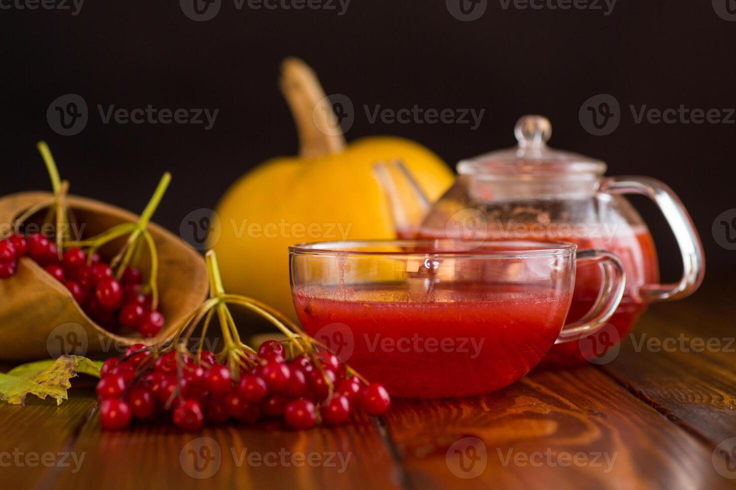 tea from ripe red viburnum on a wooden table photo