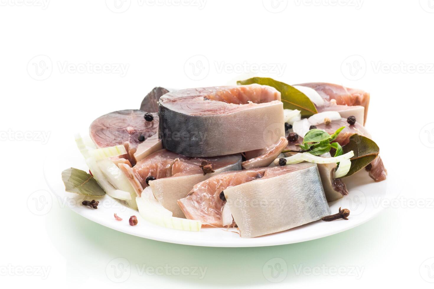 lightly salted mackerel with onions and spices, isolated on white background photo