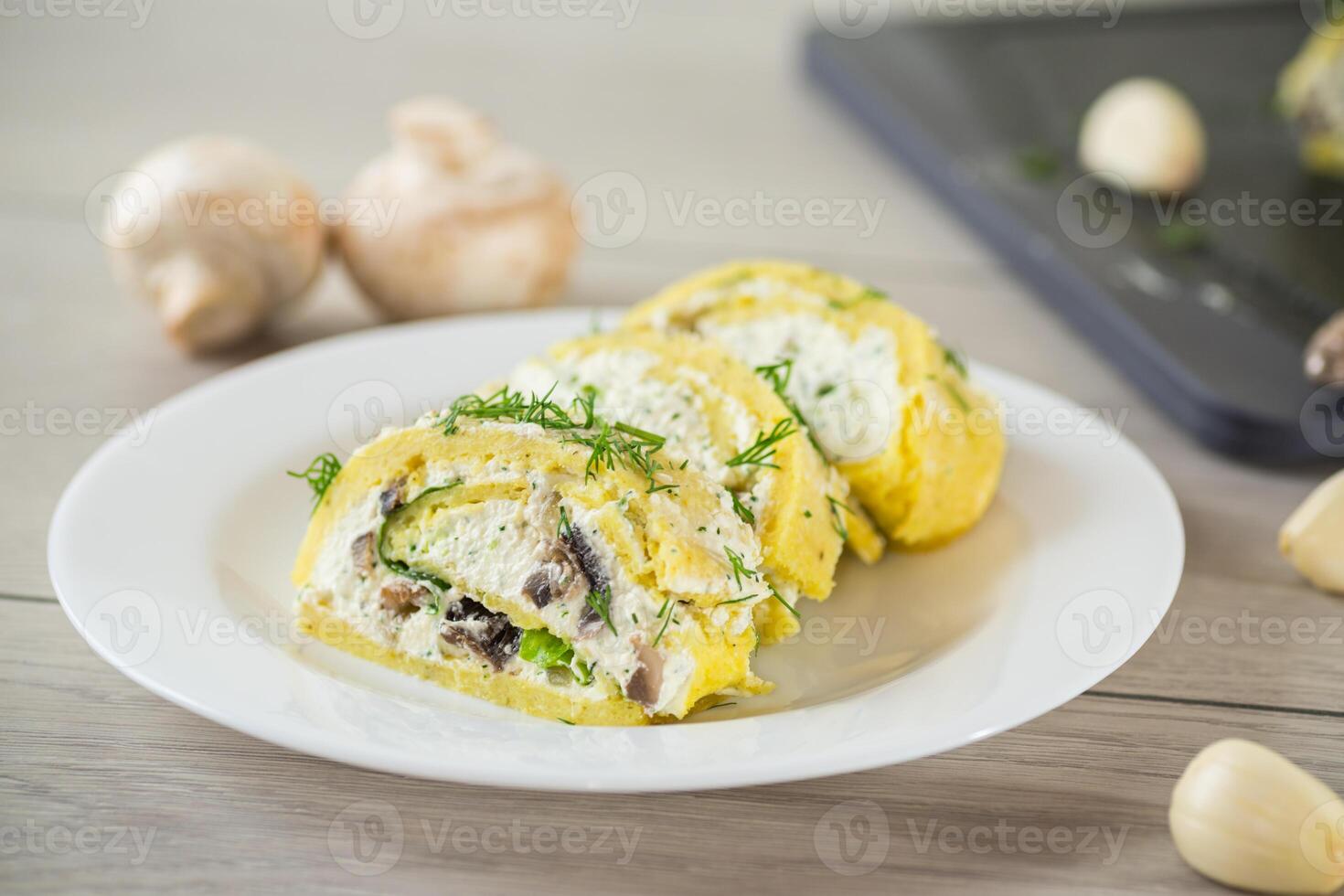 baked potato roll with cottage cheese filling with garlic and mushrooms, on a light wooden table photo