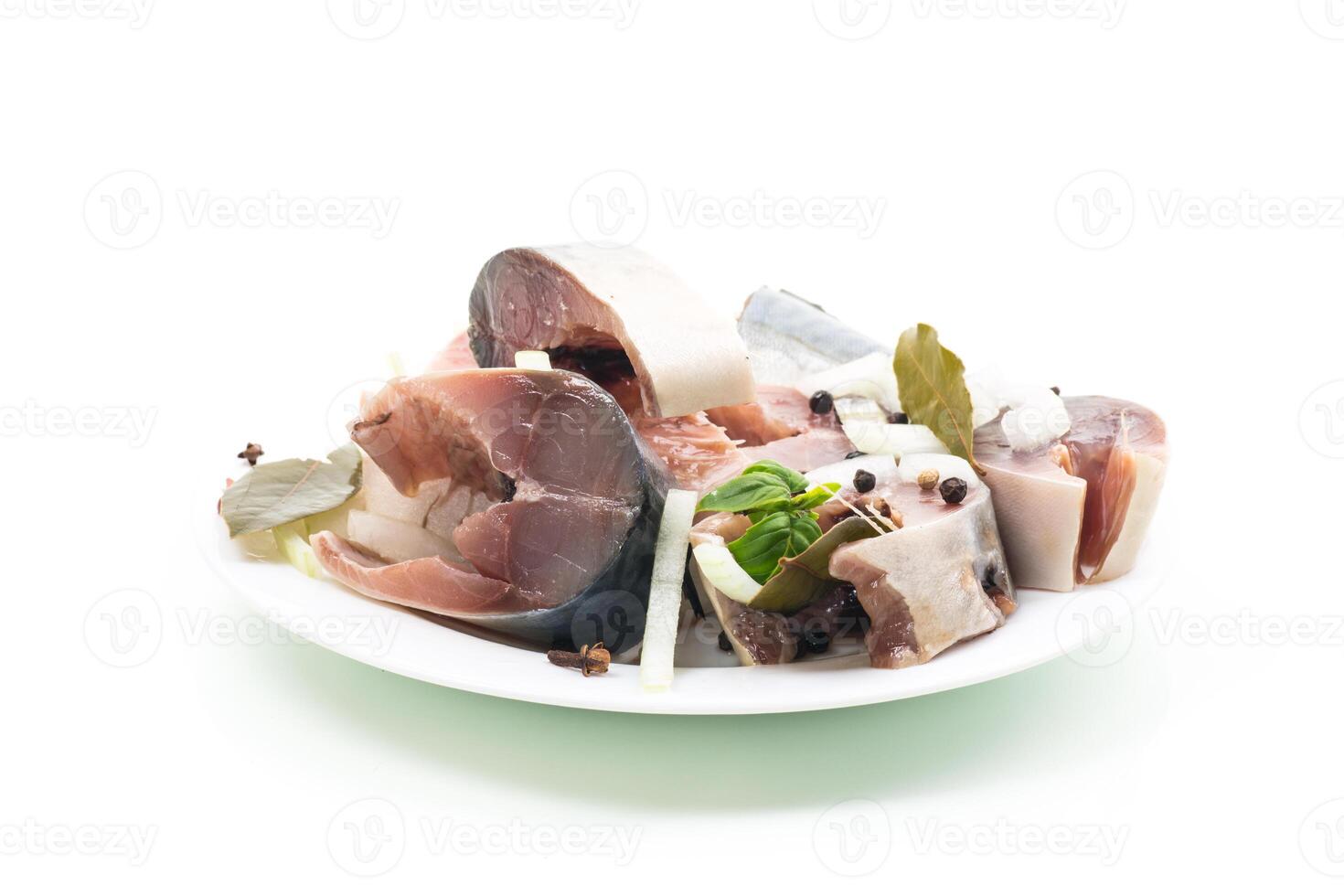 lightly salted mackerel with onions and spices, isolated on white background photo
