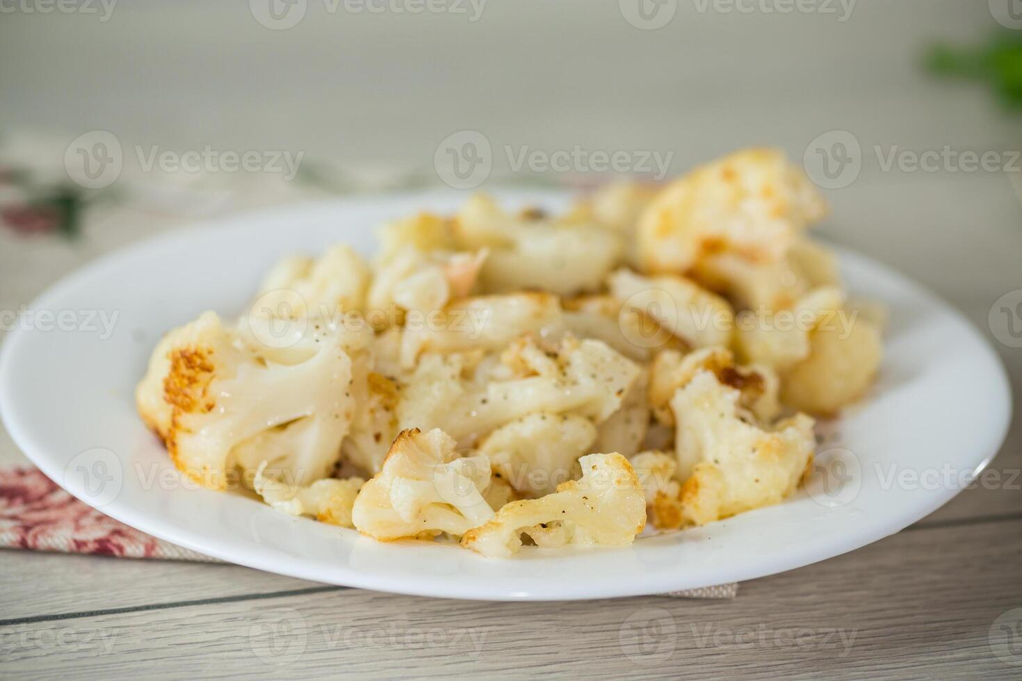 Diet boiled cauliflower fried in oil with spices photo