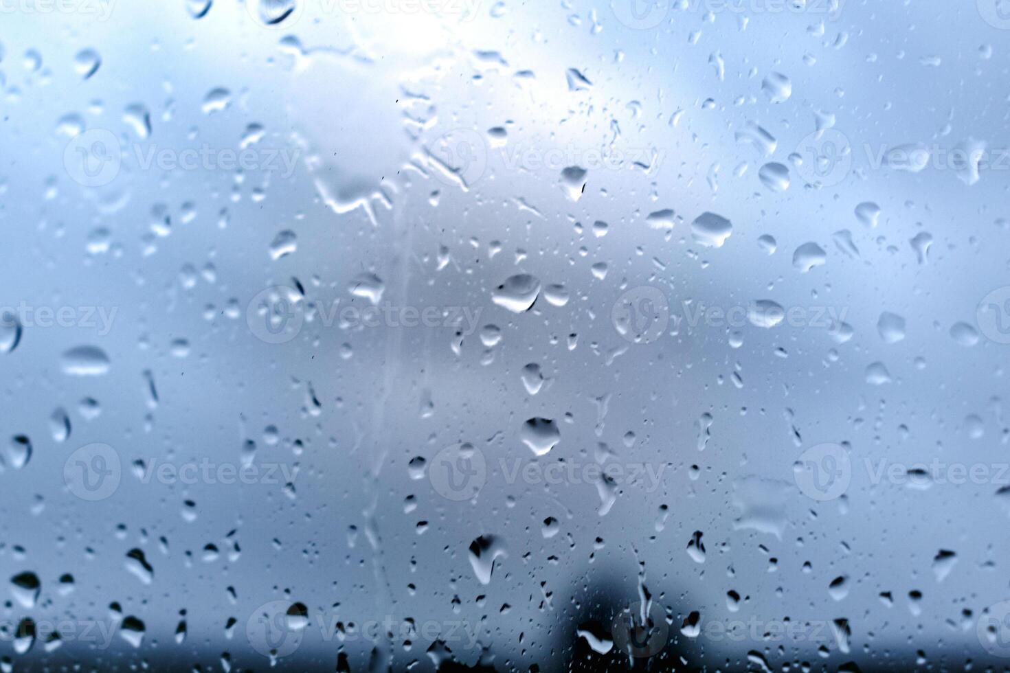 Drops on a window with a beautiful background photo