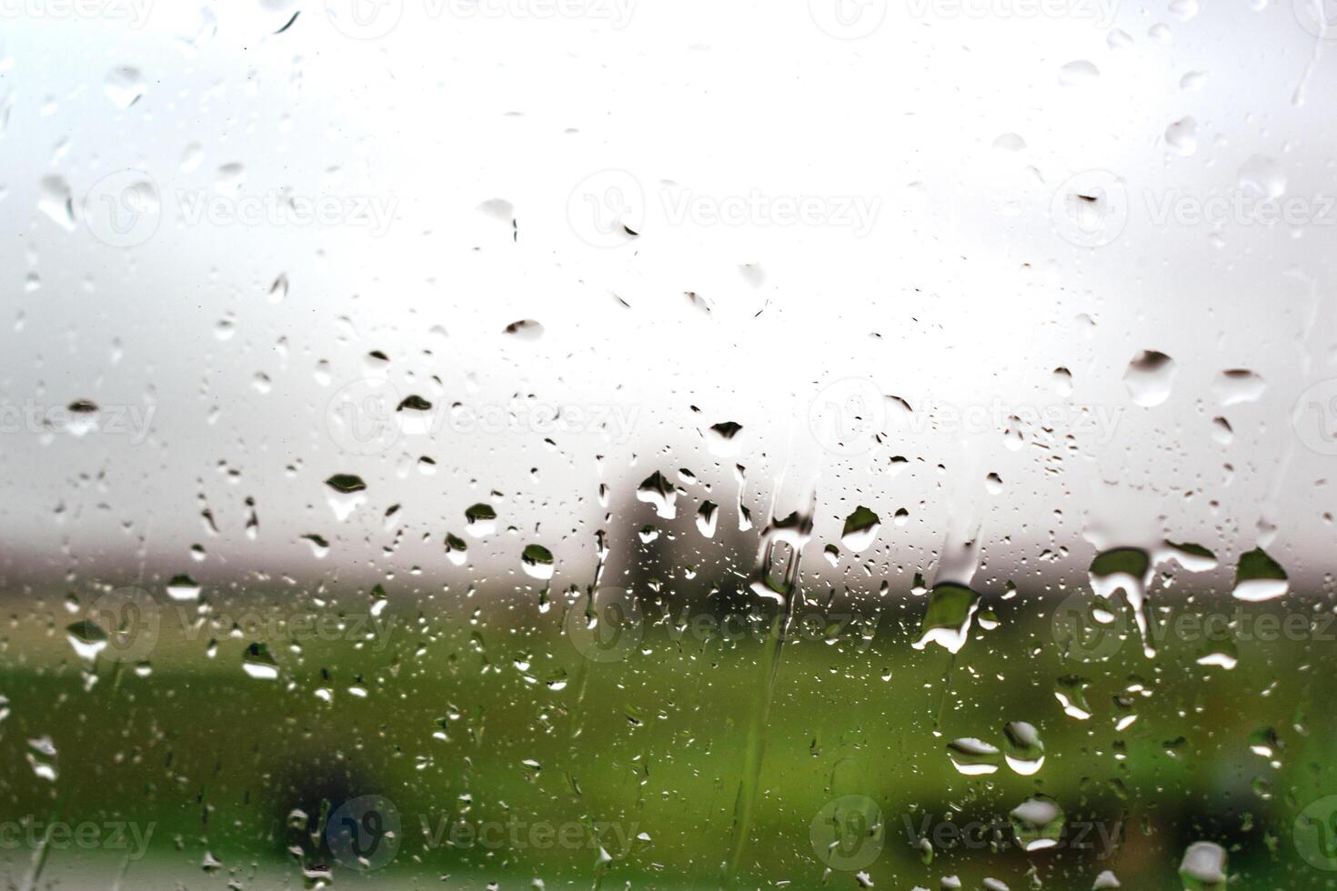 Drops on a window with a beautiful background photo
