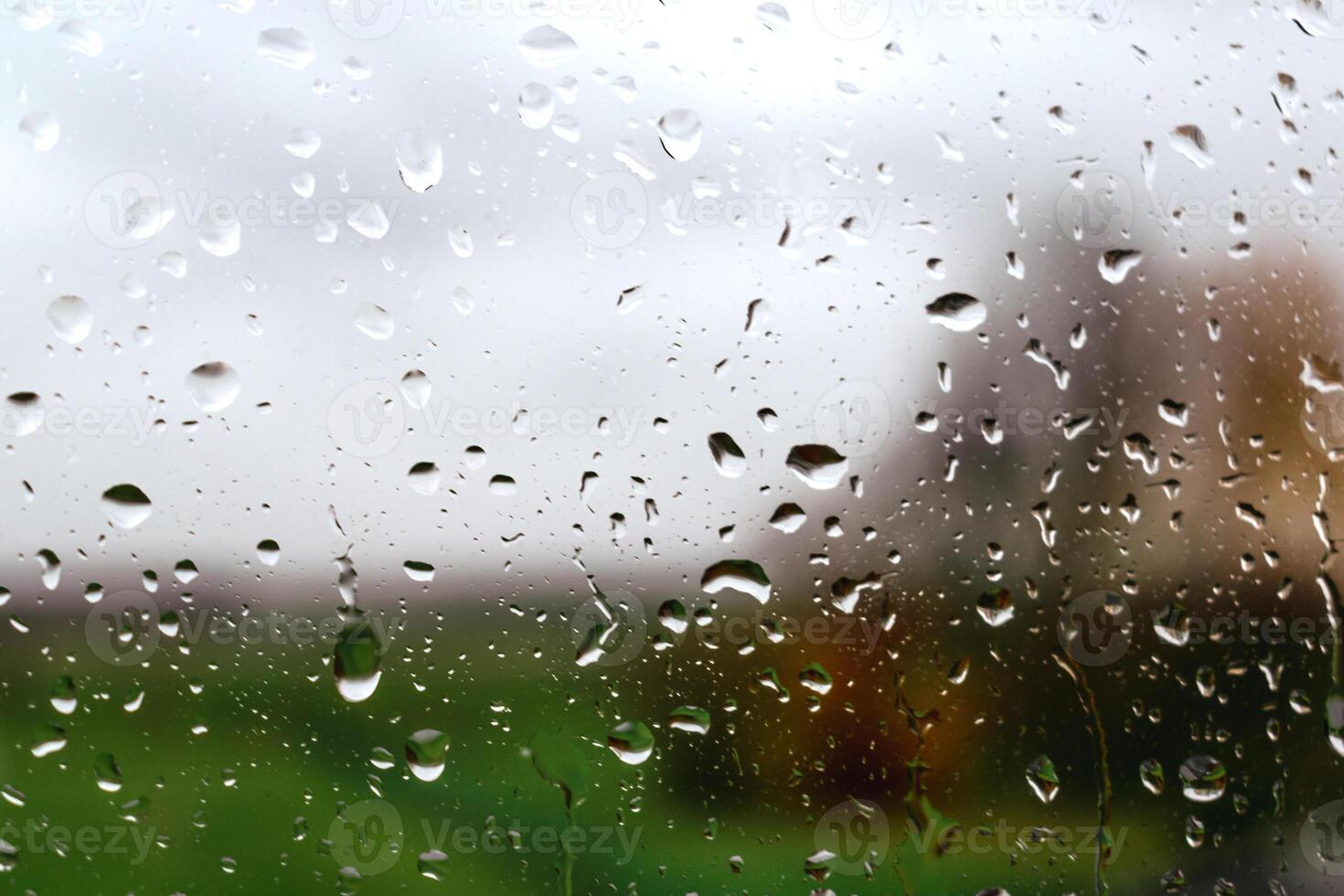 Drops on a window with a beautiful background photo