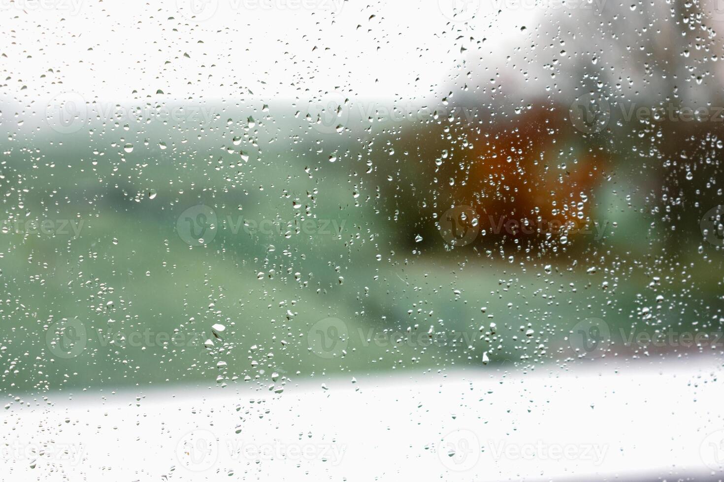Drops on a window with a beautiful background photo