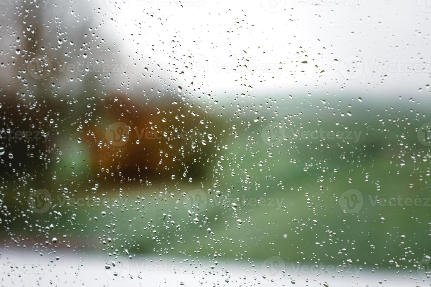 Drops on a window with a beautiful background photo